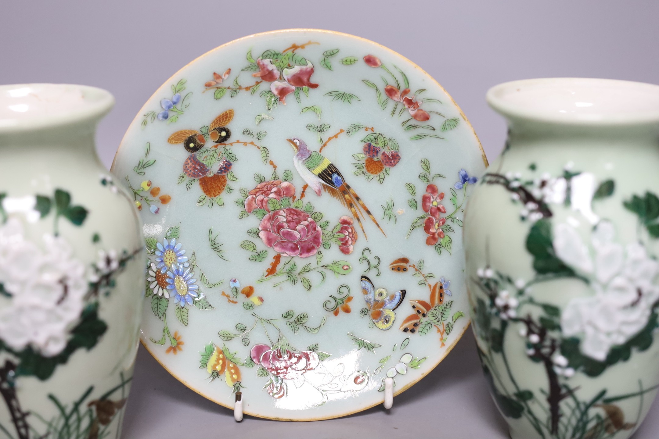 Three Chinese famille rose celadon ground plates and a pair of Japanese celadon ground vases